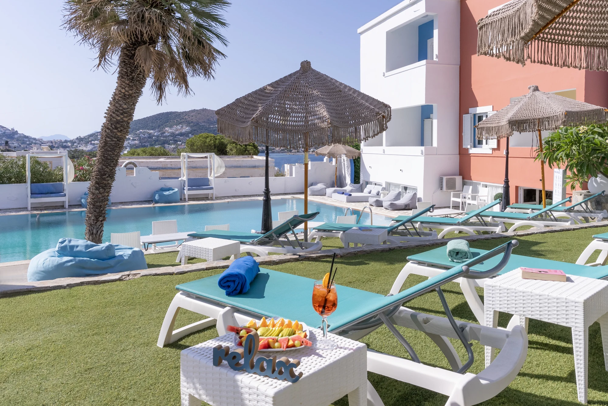 Pool and sun loungers at Saraya Resort